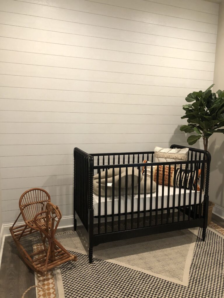 Professional shiplap effect wallpaper installation on a nursery feature wall in soft white horizontal plank pattern, Costa Blanca Spain